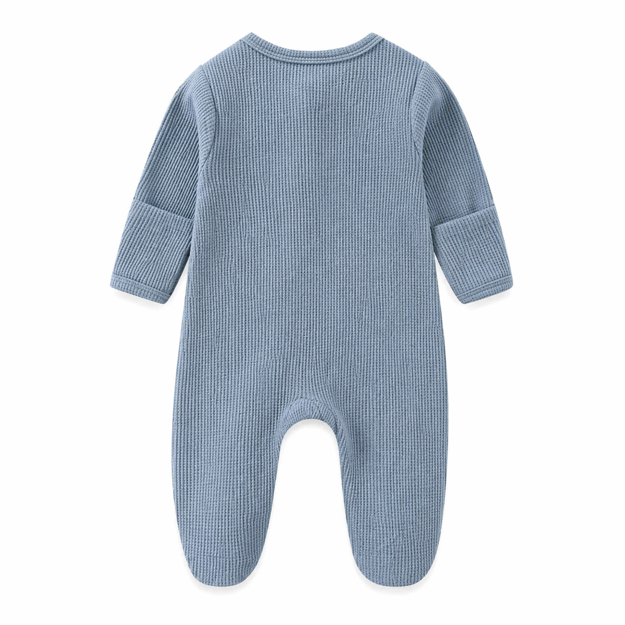 Blue baby onesie on a beige background with a green leaf