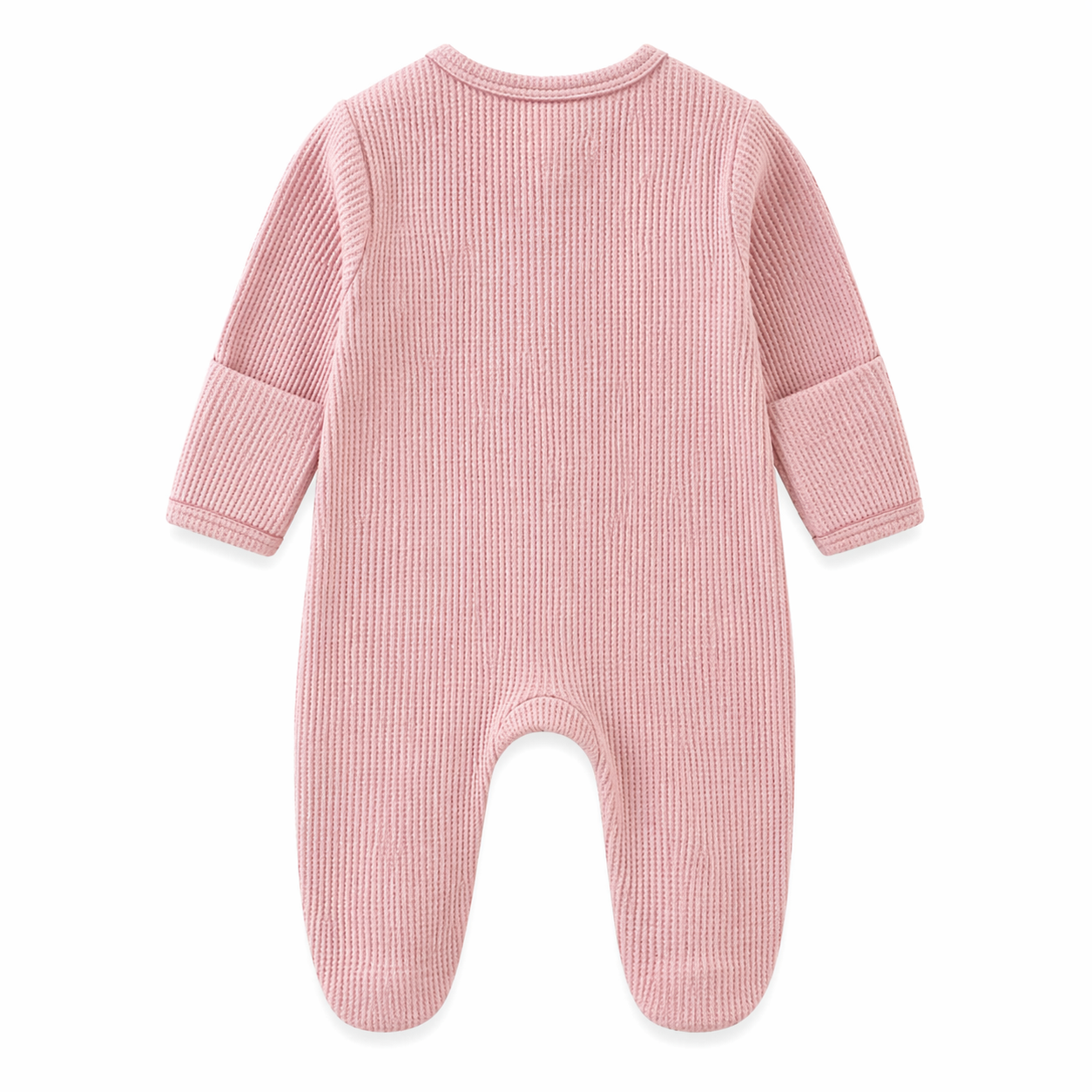 Pink baby onesie on a beige background with a green leaf