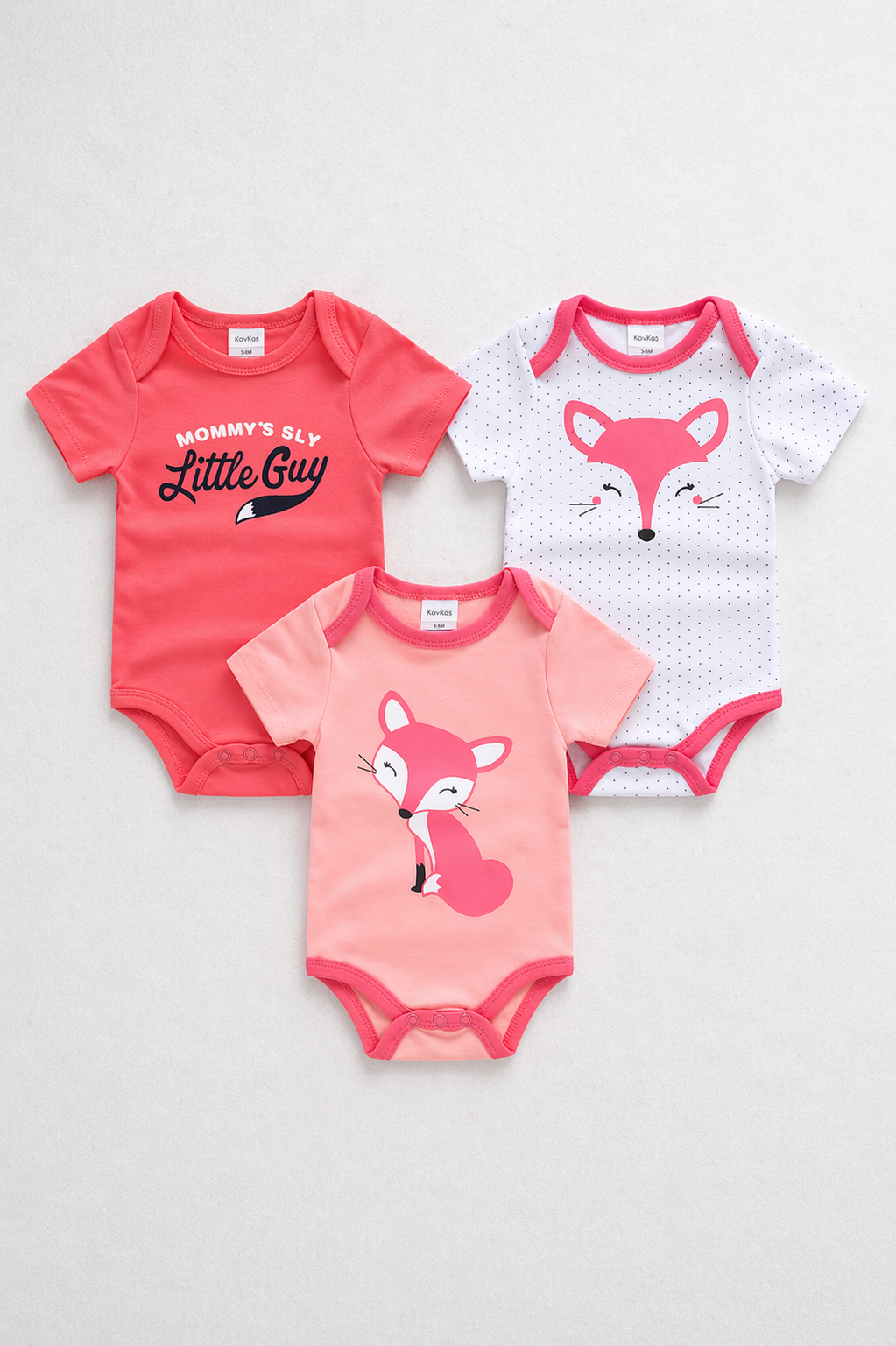 Three baby bodysuits with fox designs on a light gray background