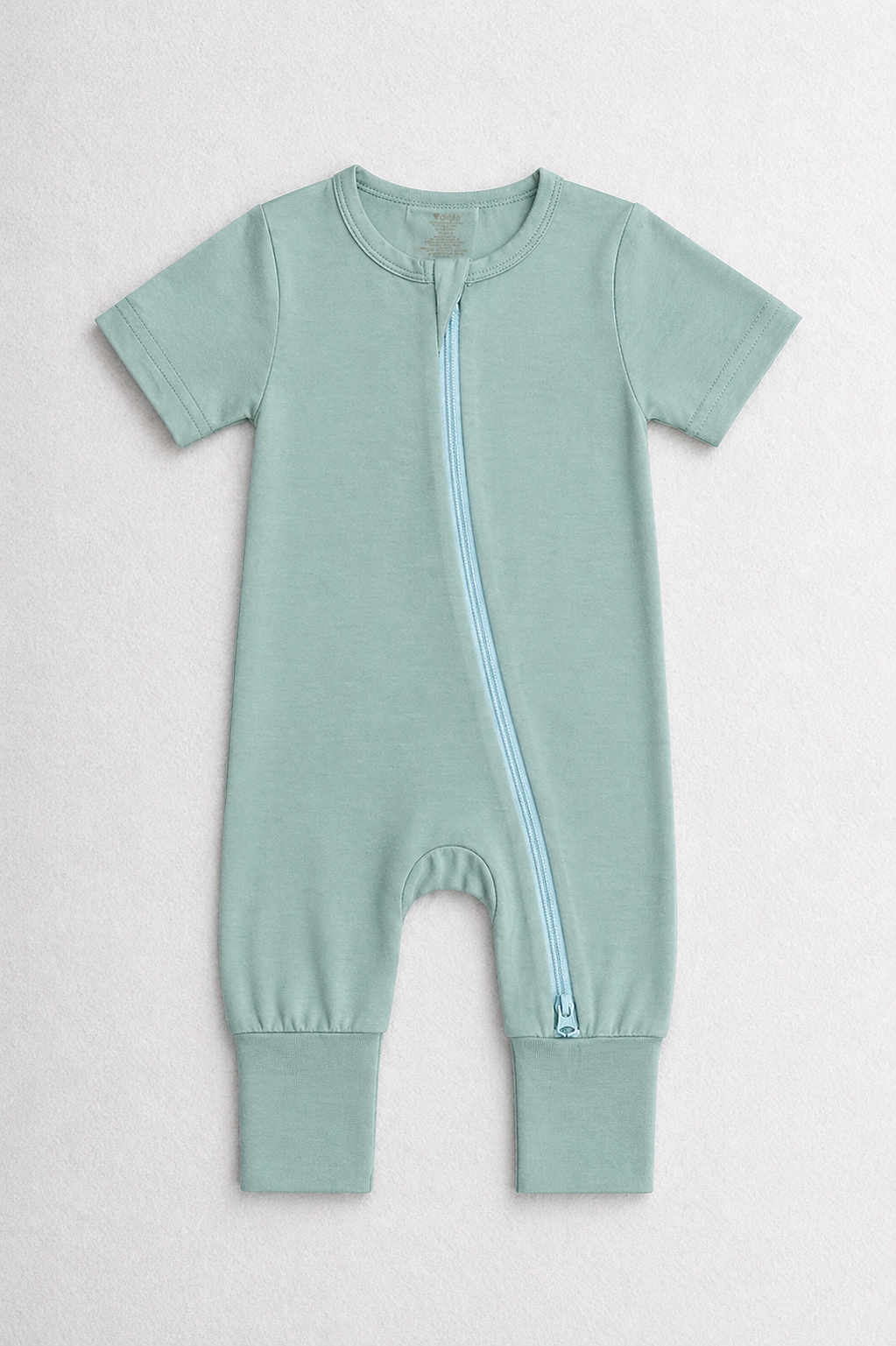 Turquoise green baby onesie with a zipper on a white background