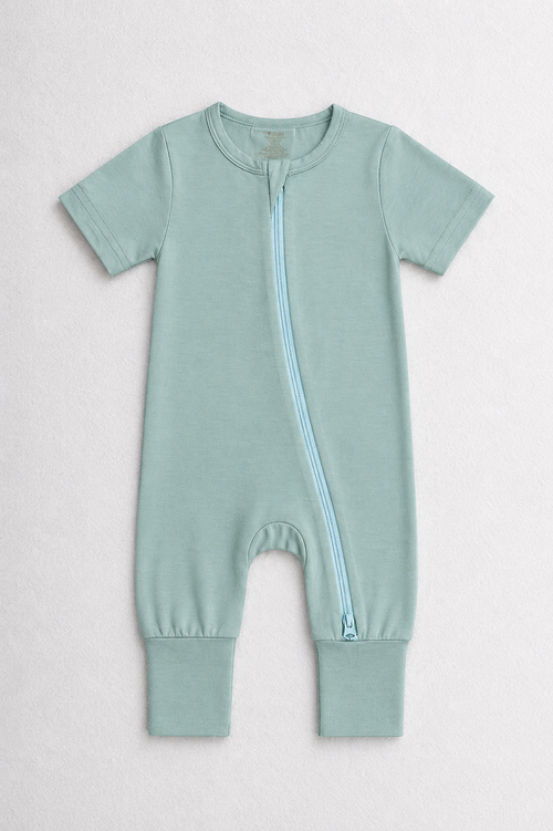 Turquoise green baby onesie with a zipper on a white background