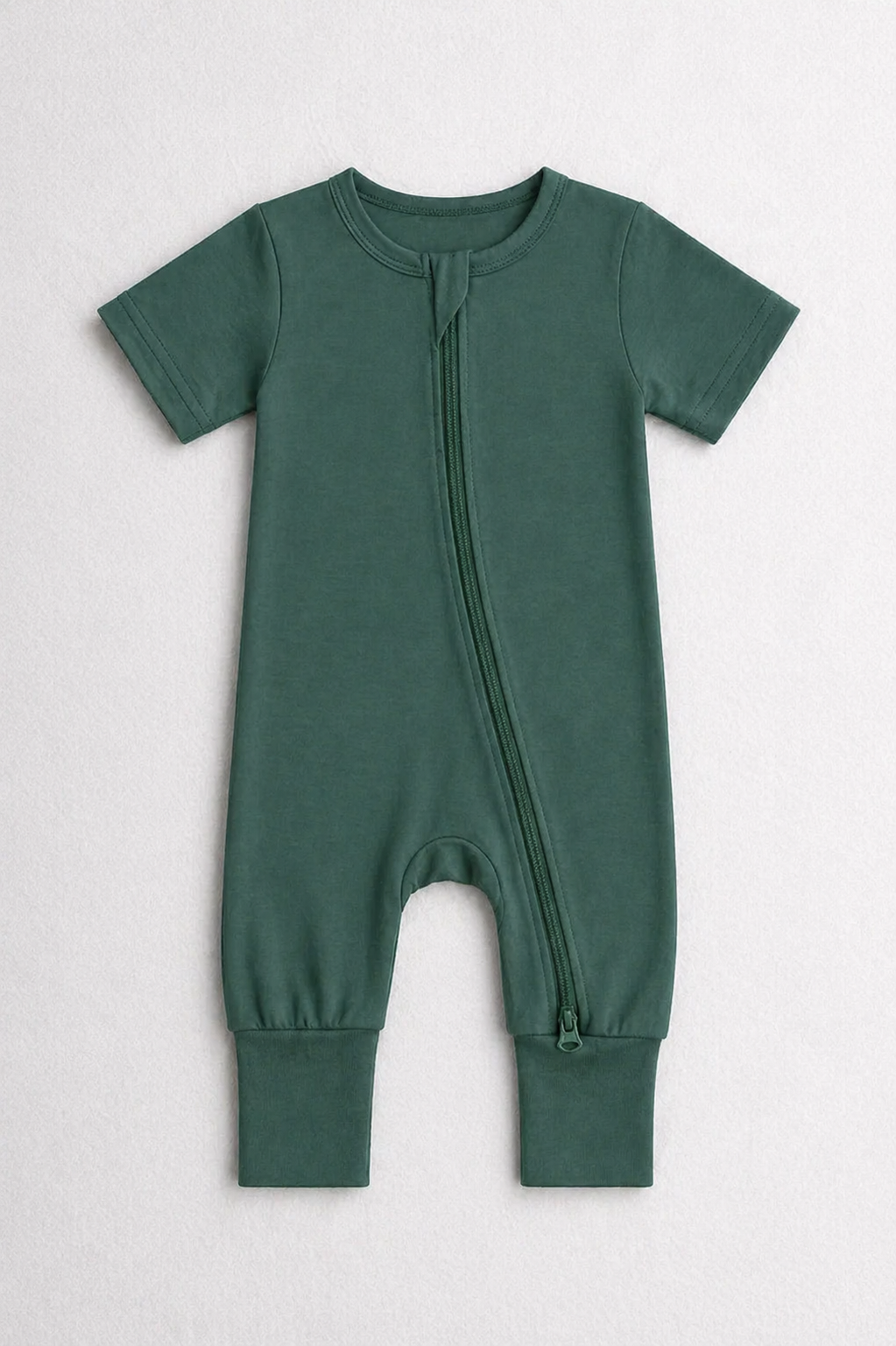 Dark green baby onesie with a zipper on a white background