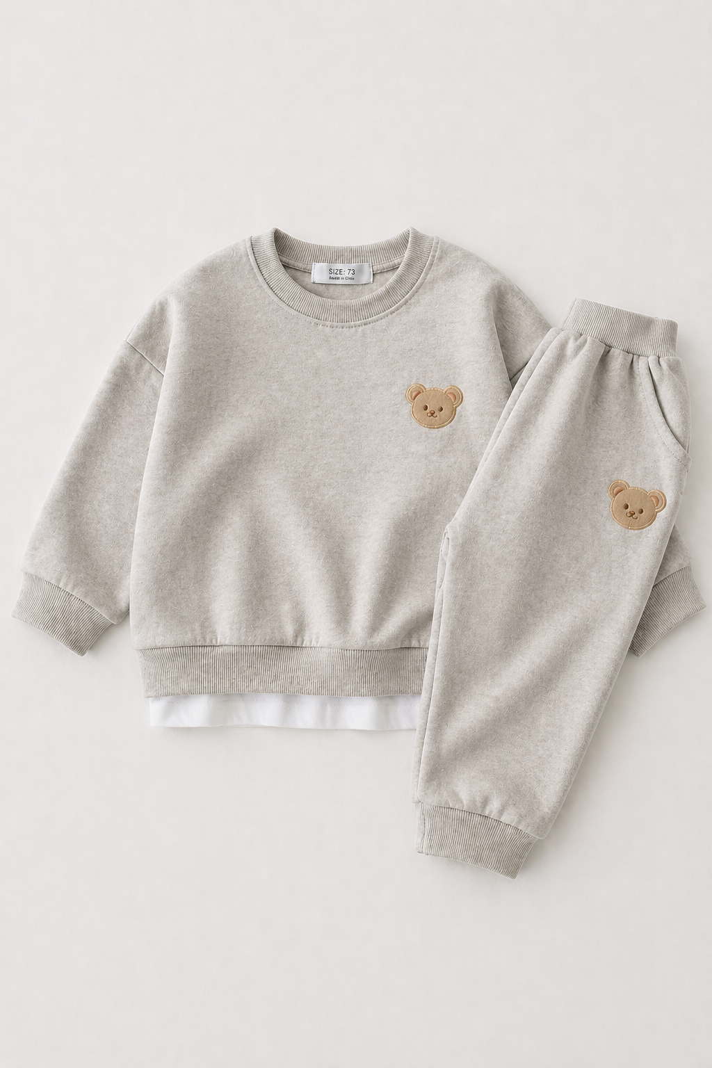 Heather grey sweatshirt and pants set with bear embroidery on a white background