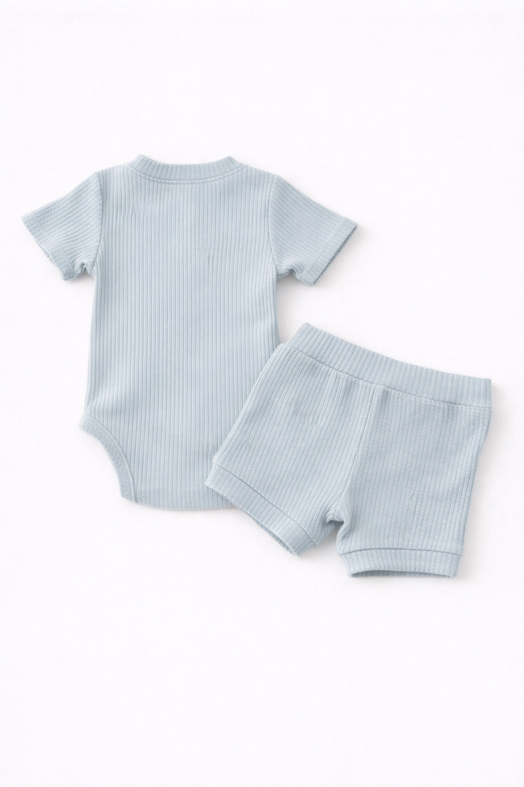 Light blue ribbed baby outfit with t-shirt and shorts on a white background