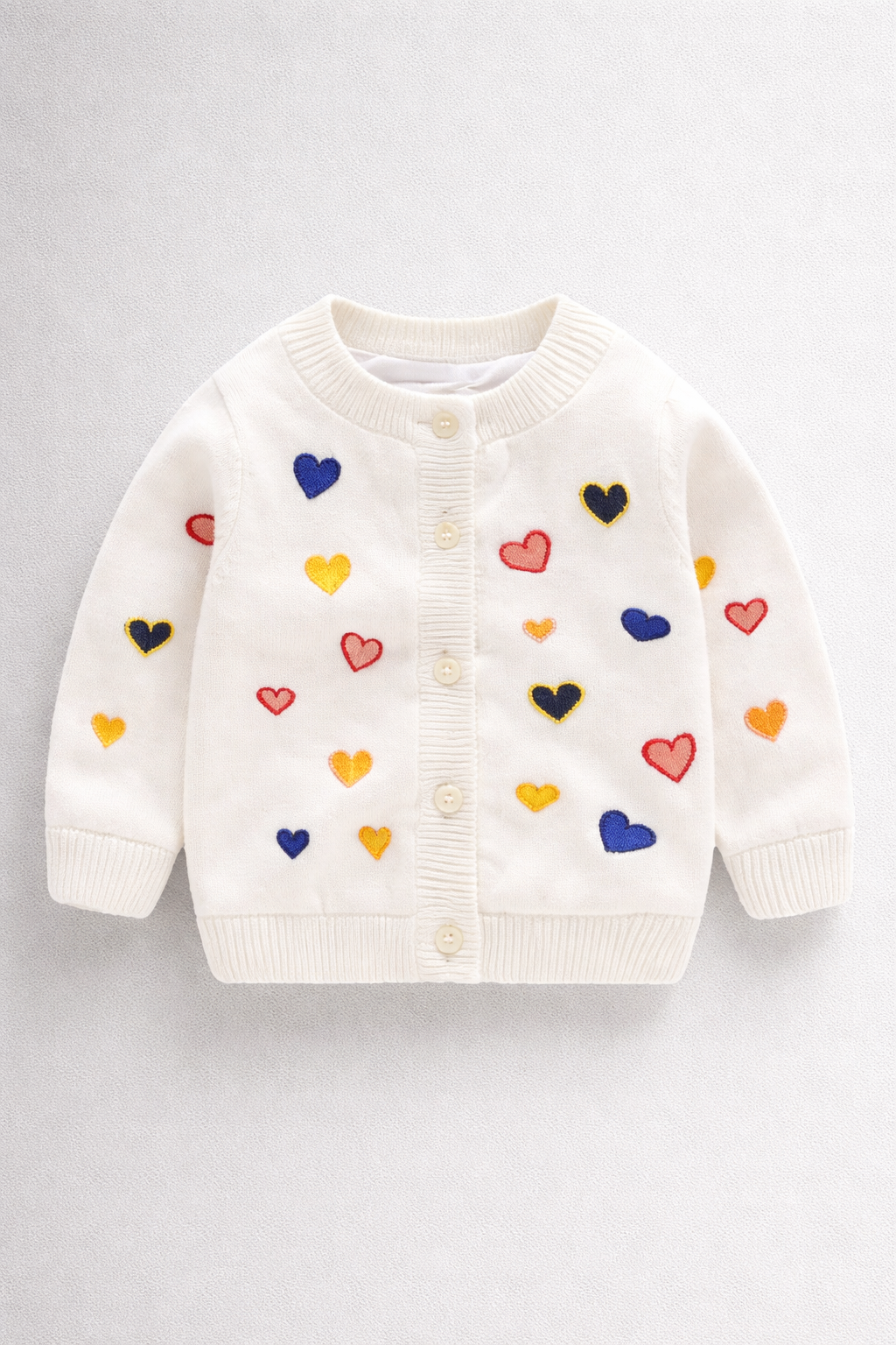 White cardigan with heart design