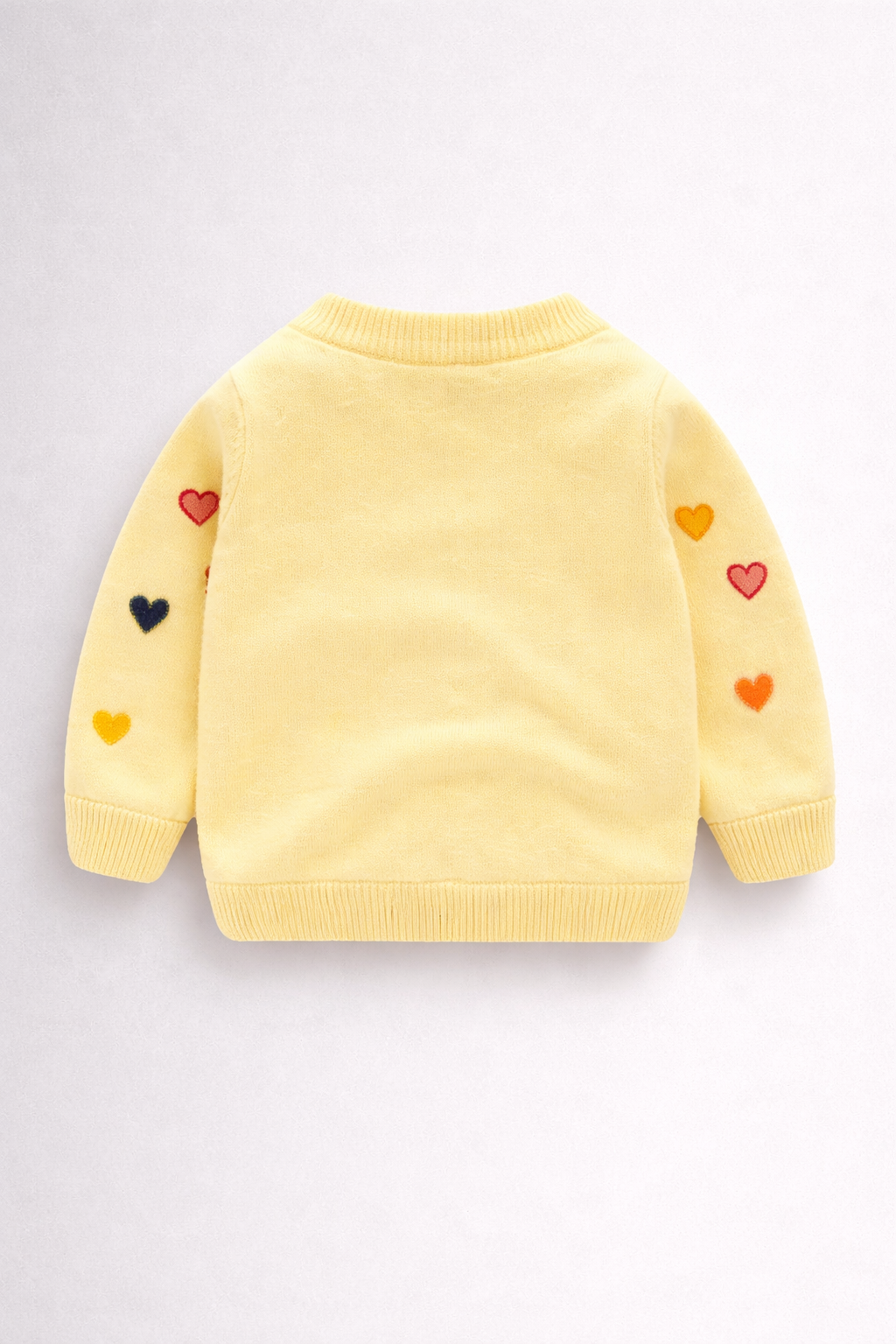 Pastel yellow cardigan with heart design