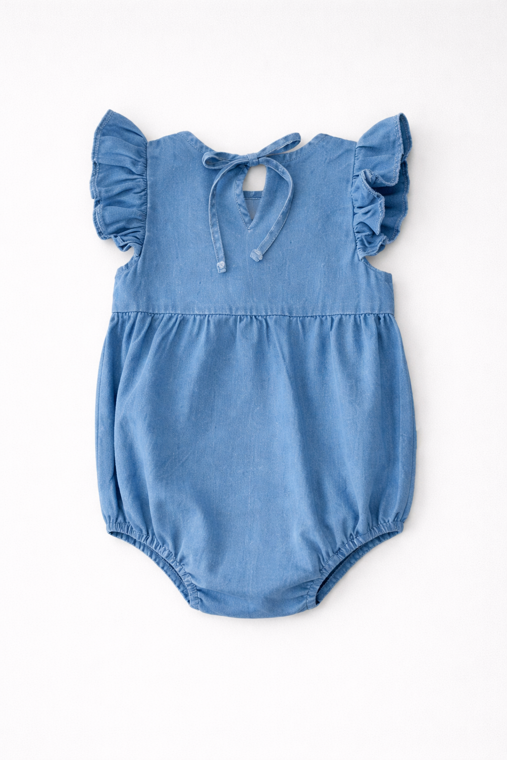 Blue baby girls romper with ruffled sleeves on a white background