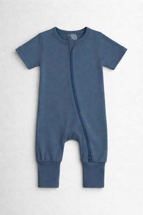 Navy blue baby onesie with a zipper on a white background