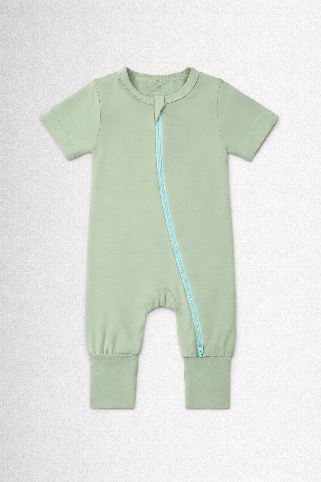 Light green baby onesie with a zipper on a white background