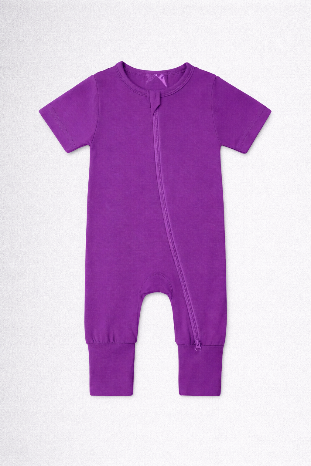 Purple baby onesie on a white background