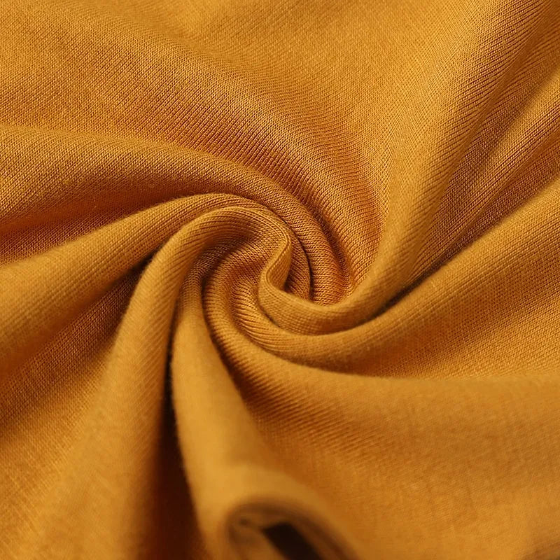 Close-up of orange fabric with a swirl pattern