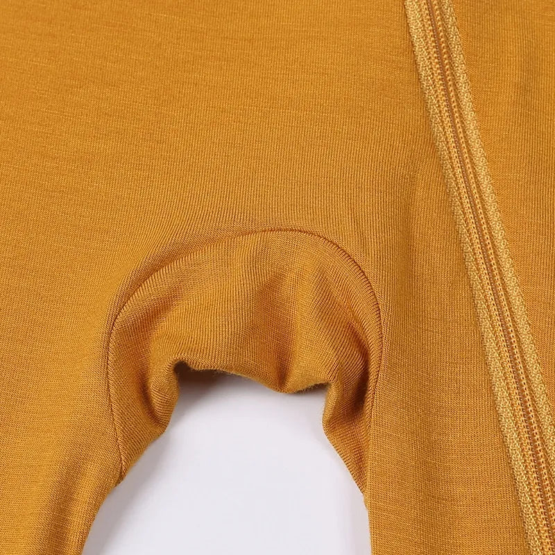Close-up of mustard yellow fabric with a white background